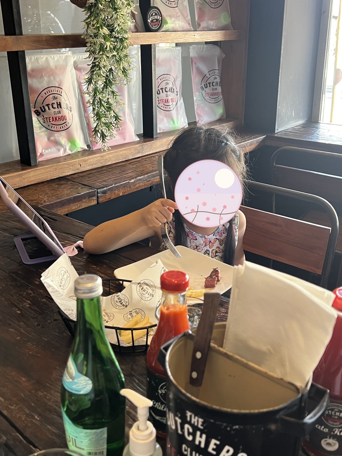 Our child eating at the steakhouse