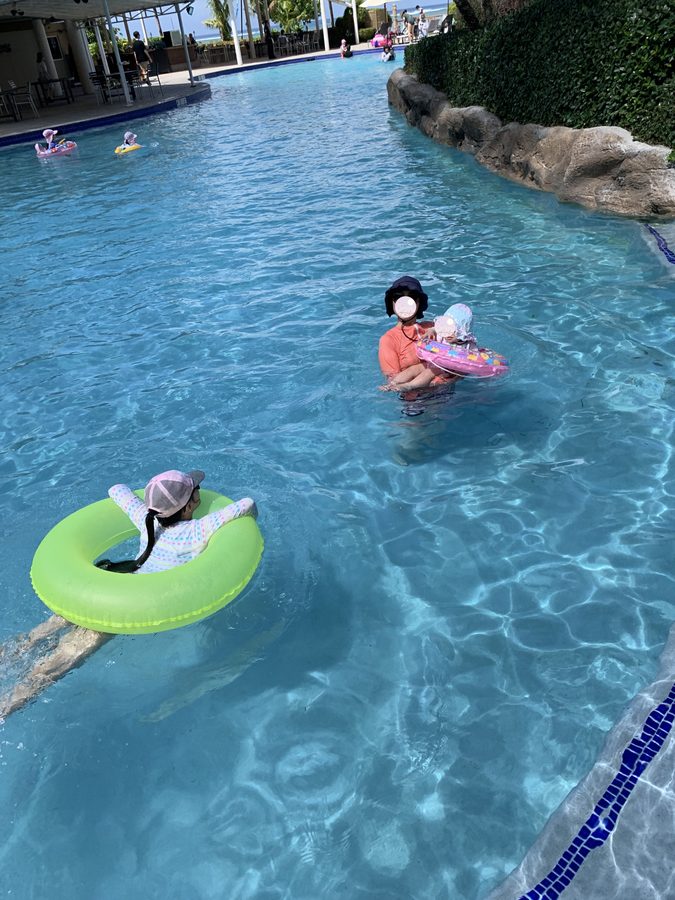 The two sisters drifting on their floats.