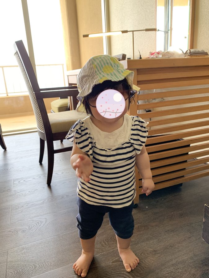 In a hat and sunglasses, thoroughly pleased with herself.