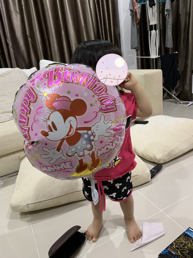 Delighted with a balloon.