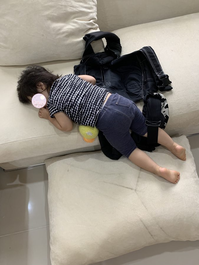 Worn out from playing, and asleep where she fell.