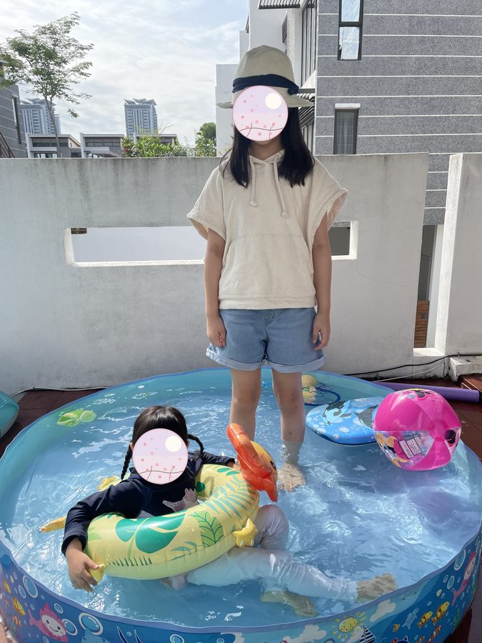A paddling pool in the garden — one of the few pleasures on the days we could not go out.
