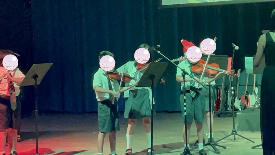 Epsom's Christmas concert, mid-performance (she is second from the left).