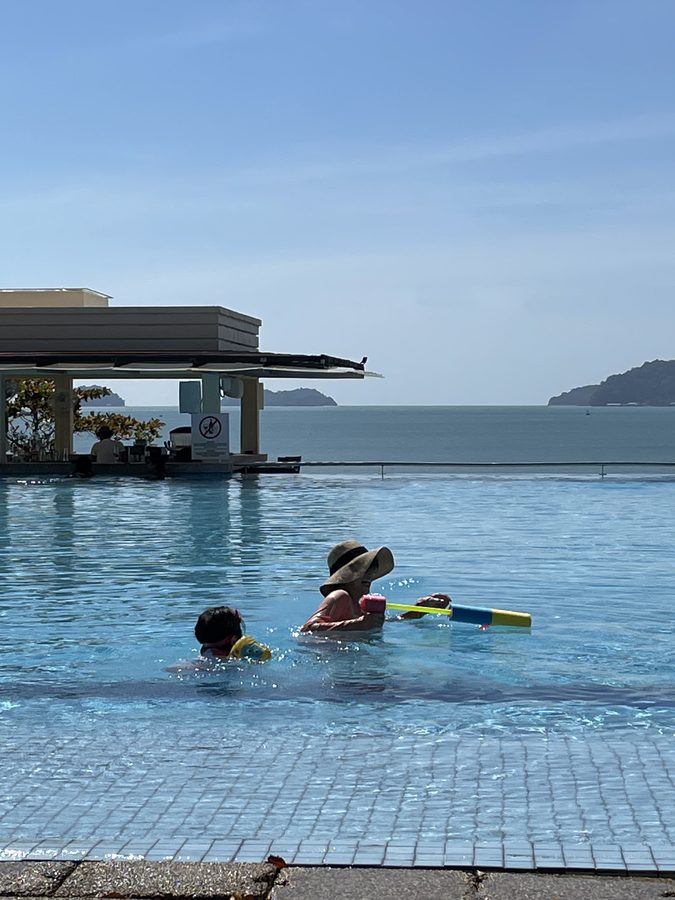 Swimming with the hills in the background.