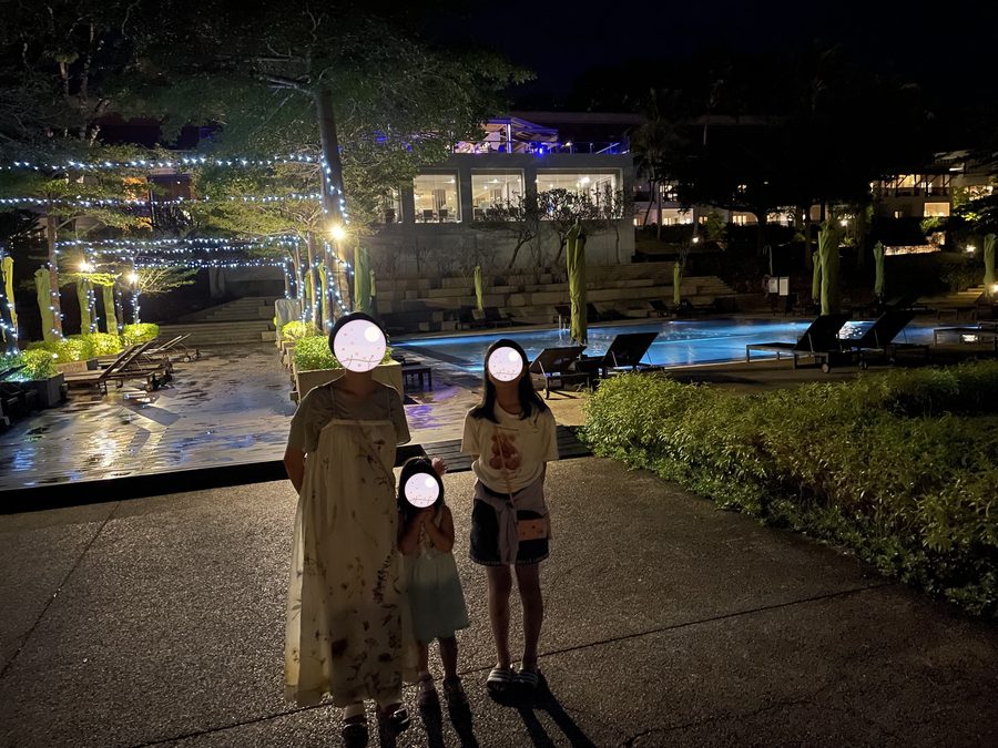 Lit up at night — father and daughter out for a walk.