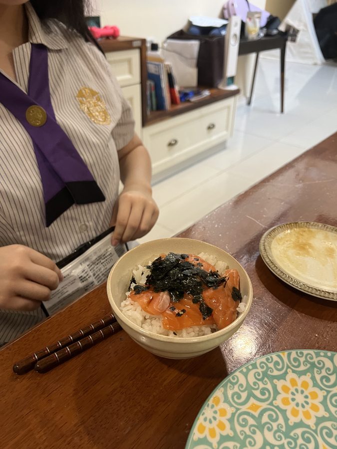 A rice bowl with salmon and ikura.