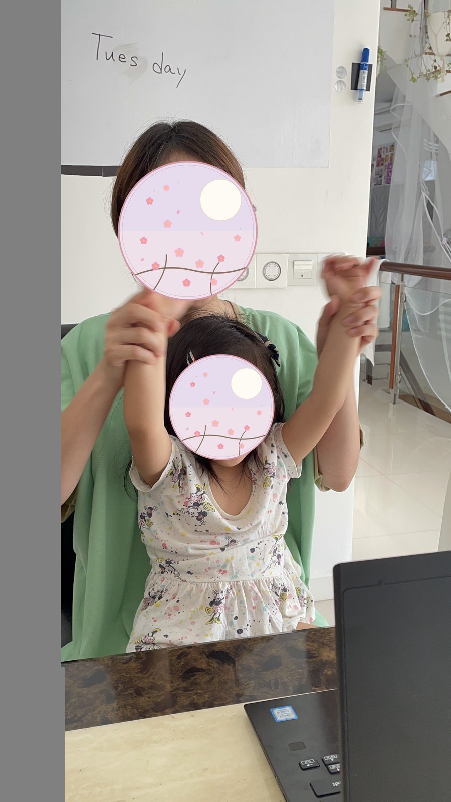 My child doing online schoolwork at home while I watch nearby