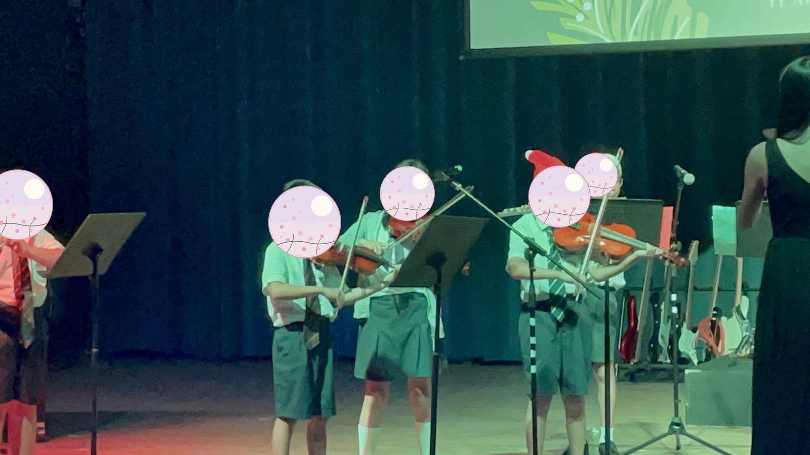 Kids performing violin at the Christmas concert