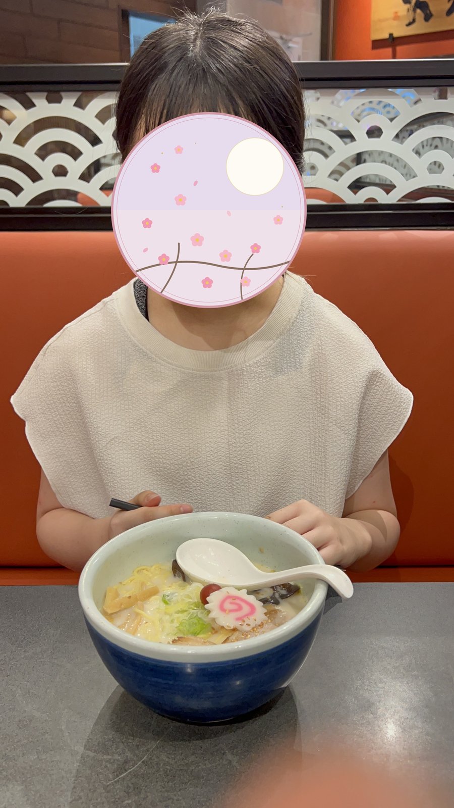 Enjoying ramen at a restaurant