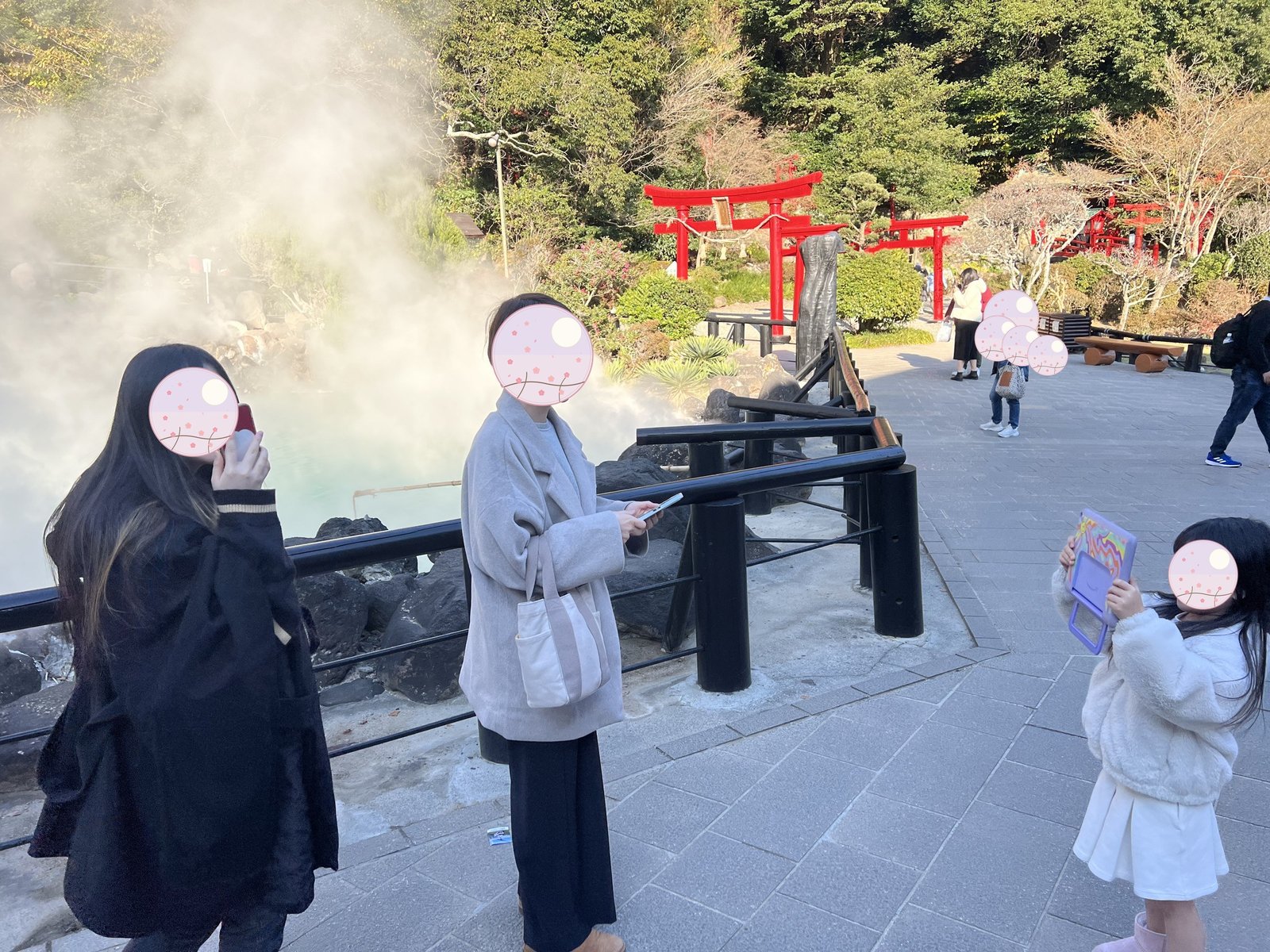 The family taking in the vermillion torii gates at Hakuryu Inari Okami 