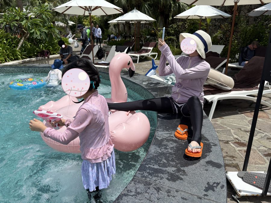 Beside the children's pool. They brought toys in and played.